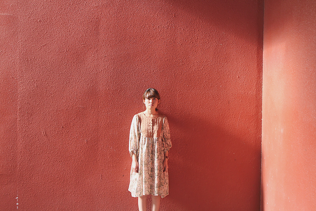 Girl against red background (low contrast)