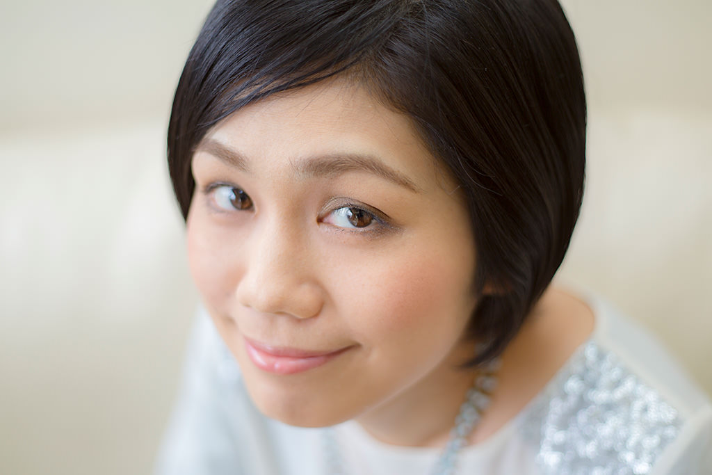 Head-shot of lady with back eye blurred