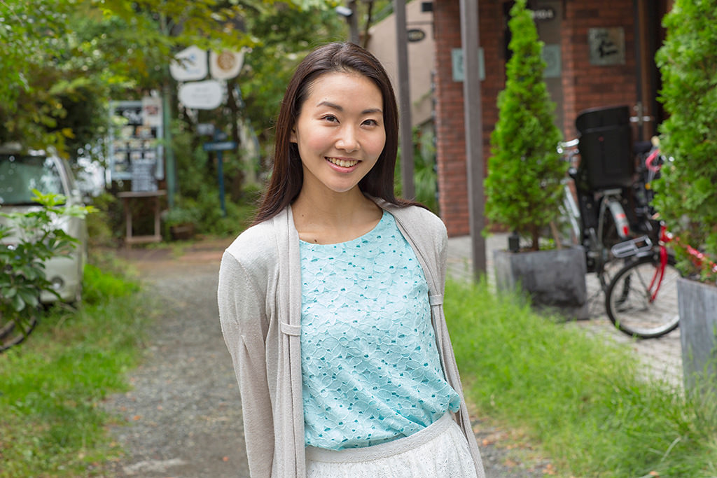 Portrait of lady outside house