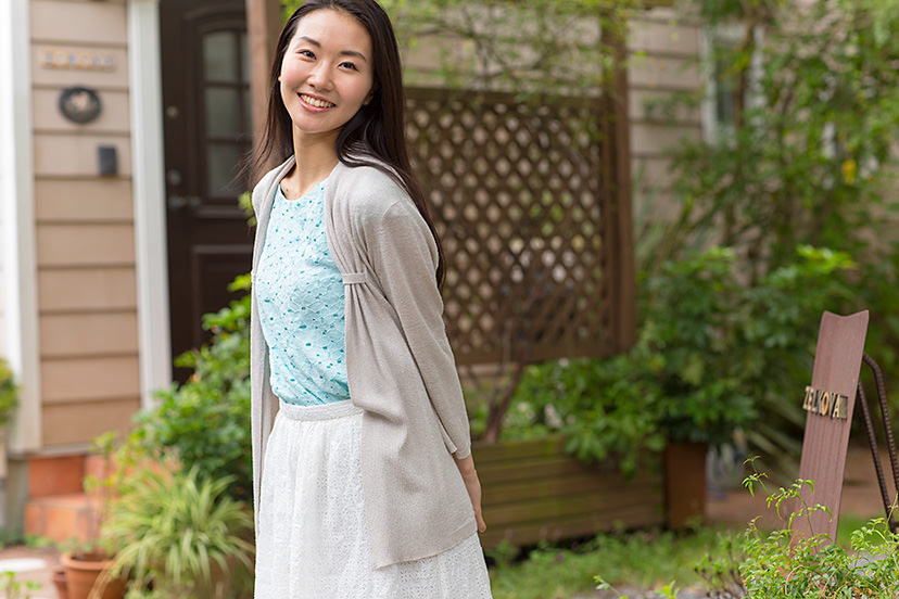 Portrait of lady in front of building