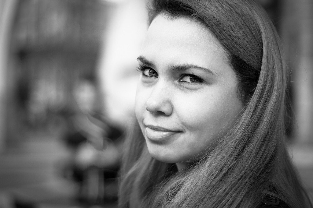 monochrome portrait of woman against blur background