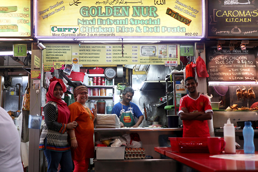 Mariam Abdullah with her daughter and staff
