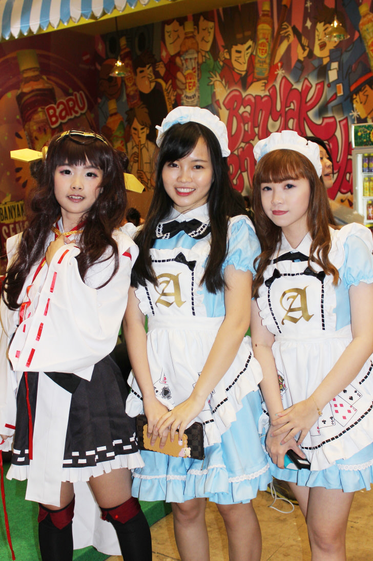 Cosplayers and cosplay photographers Lucetta Joselyn and Rachel Winardi with another cosplayer