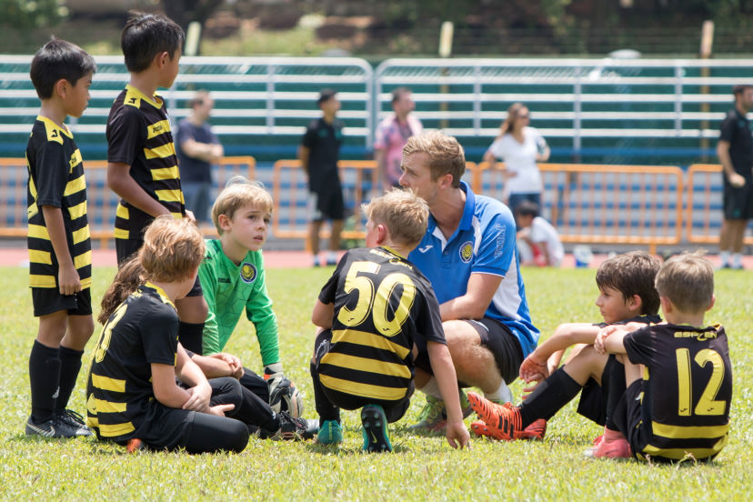 Coach soccer team meeting