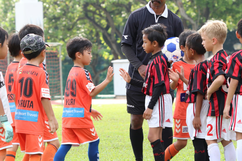 soccer kids shaking hands
