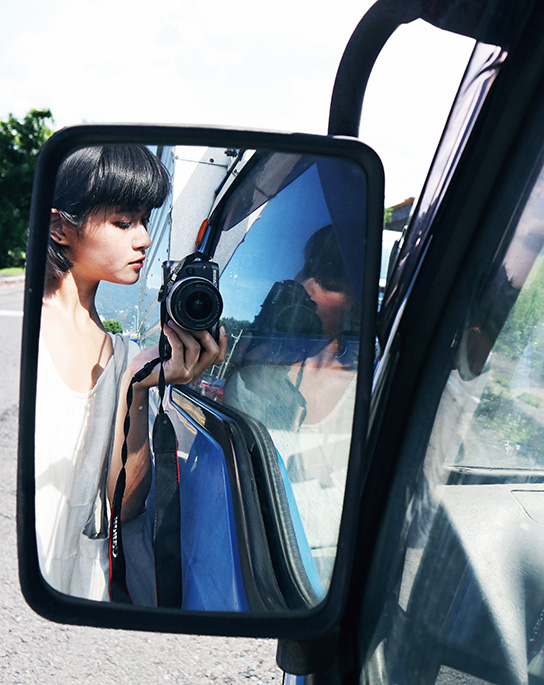 Self-portrait through car side mirrors with the EOS M6