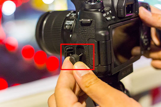 Insert the remote switch into the camera