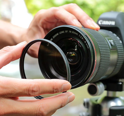 Use a PL filter to minimize reflection of light