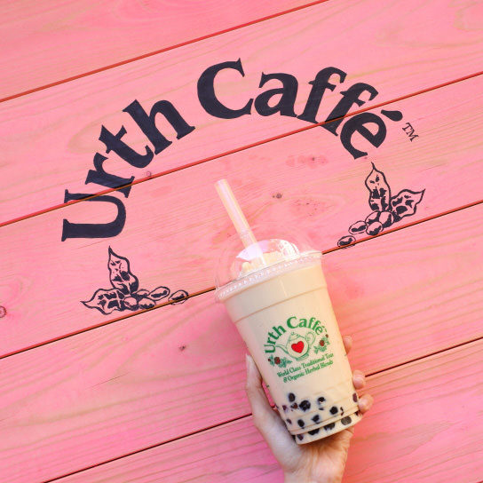 Bubble tea against a pink wall