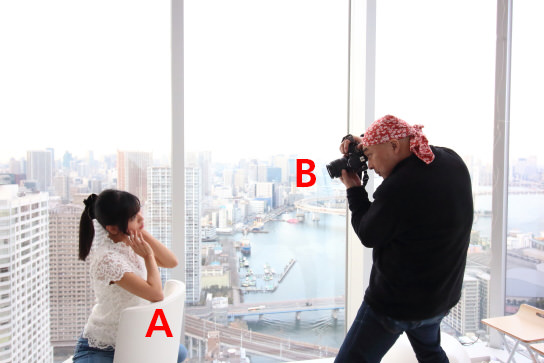 Shooting a portrait (elbows on chair)