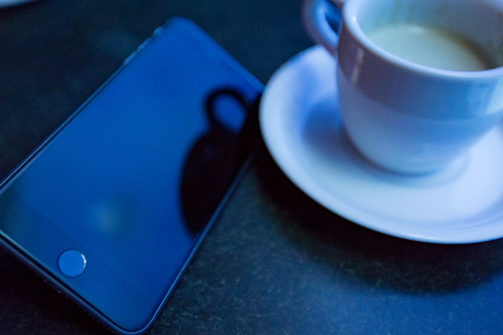 Smartphone and coffee cup (no reflection, failed shot)