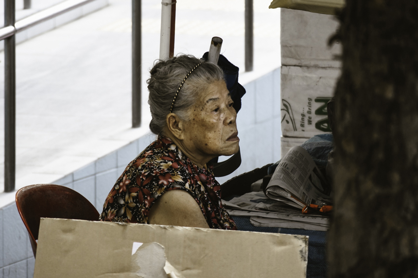 old woman sitting down
