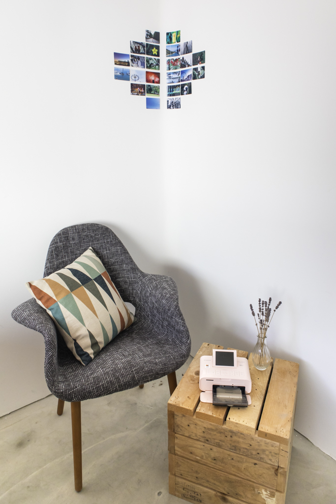 reading corner with photos on the wall