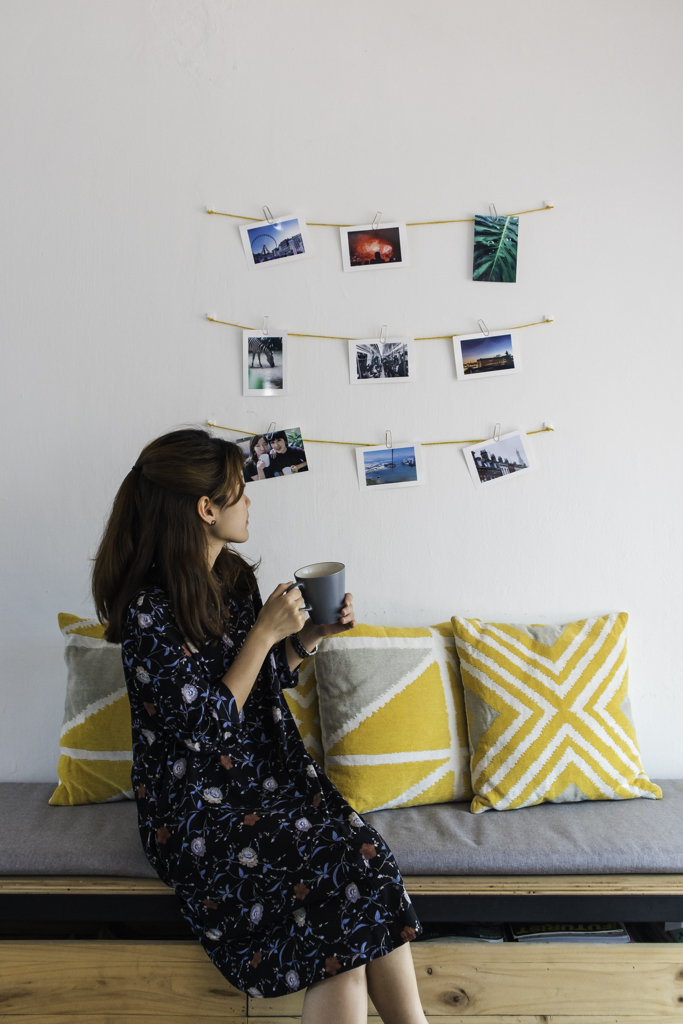 girl holding cup sitting down