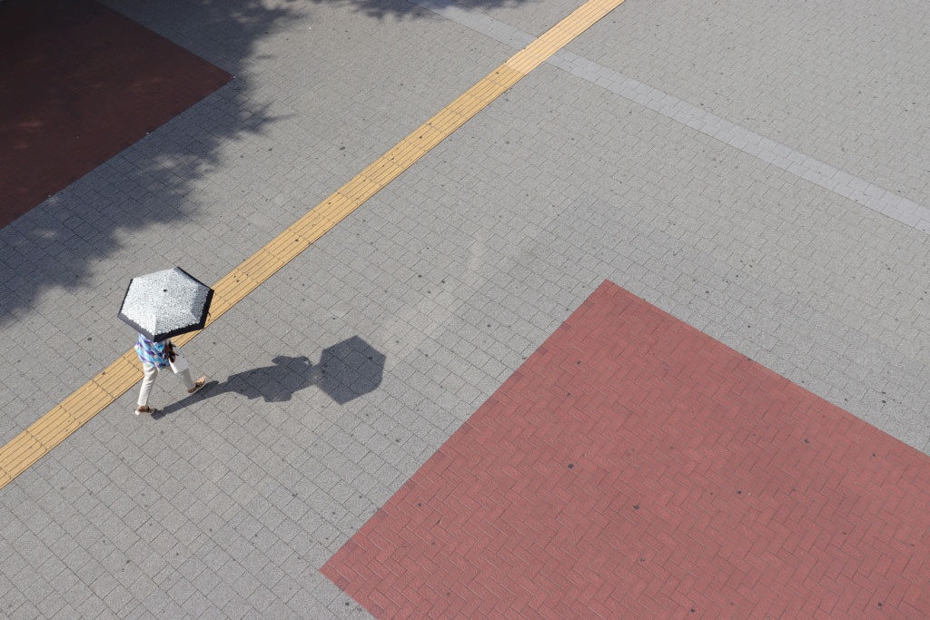 Street photography example of passerby and geometric patterns