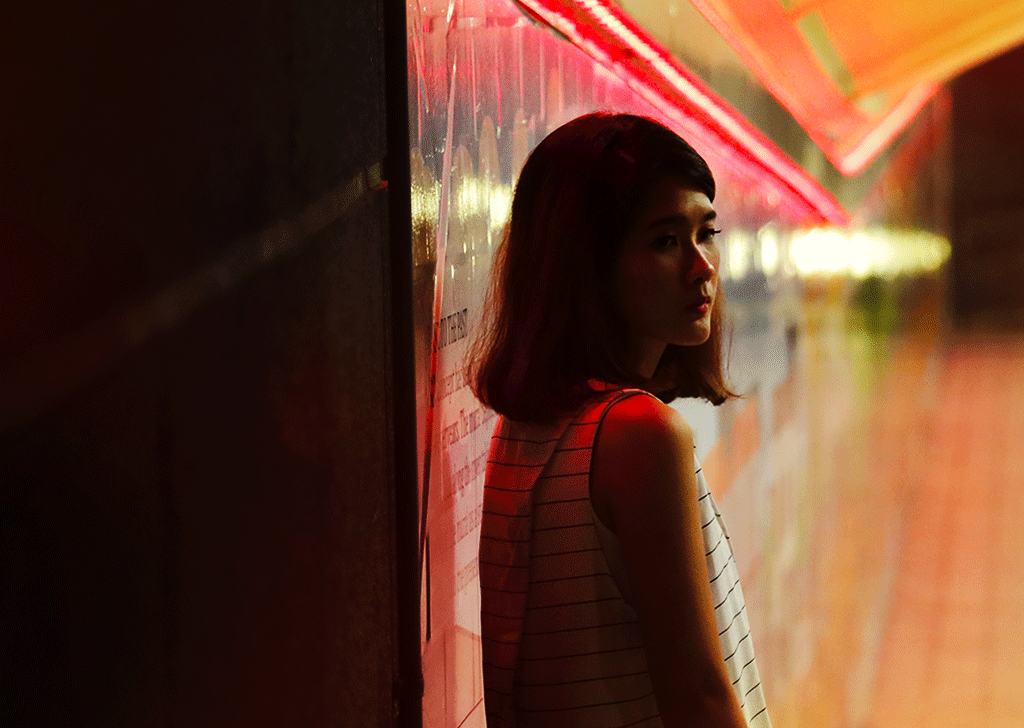 girl in shadow under a tunnel