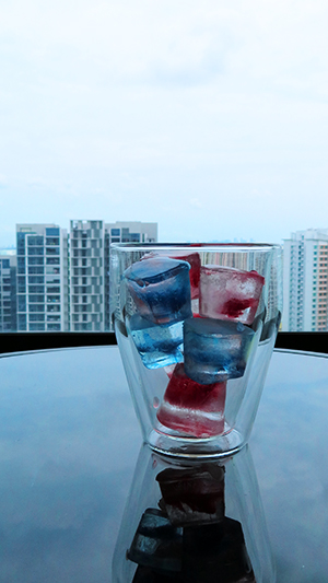 coloured icecubes in a glass