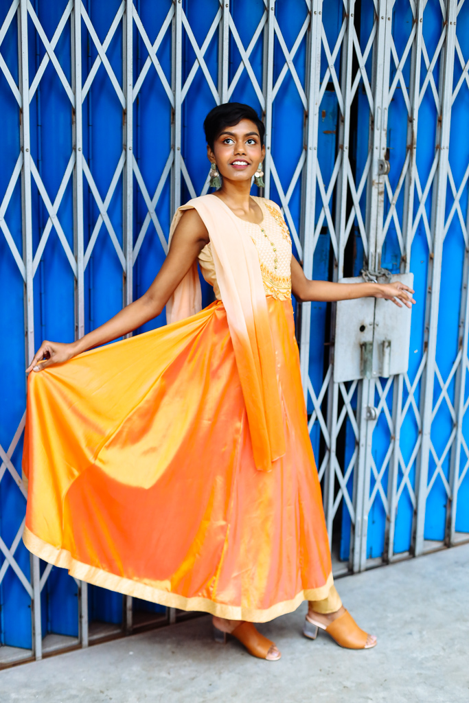 deepavali female model orange outfit