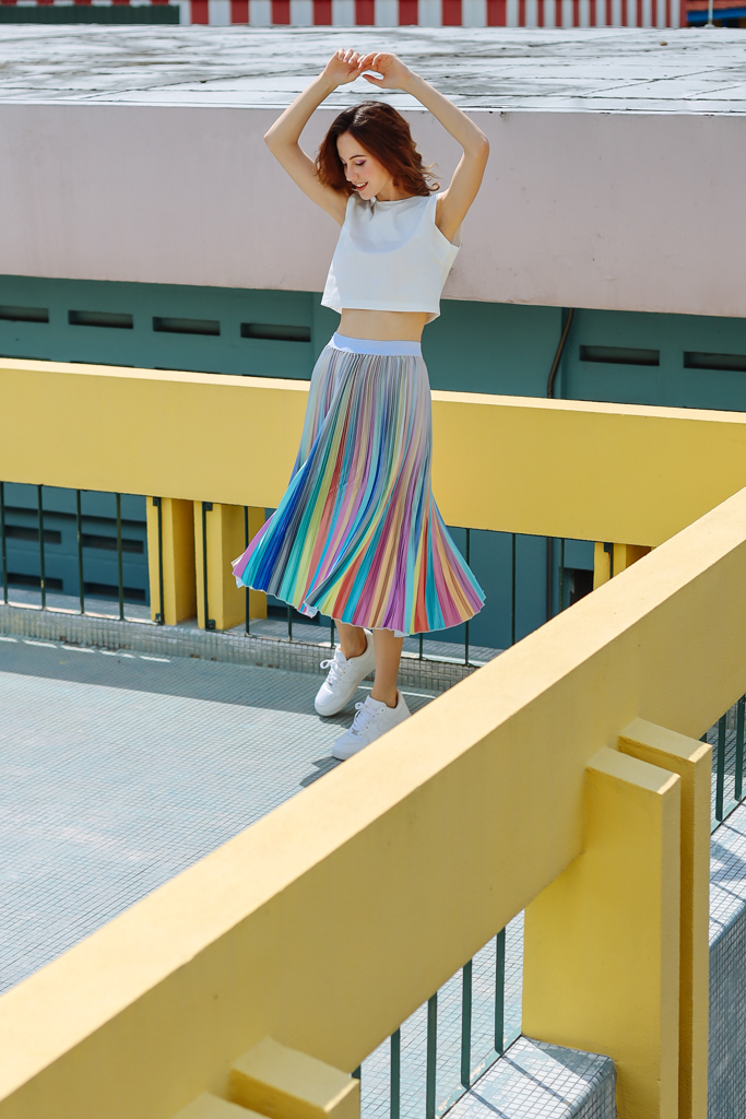 female twirling with colourful skirt