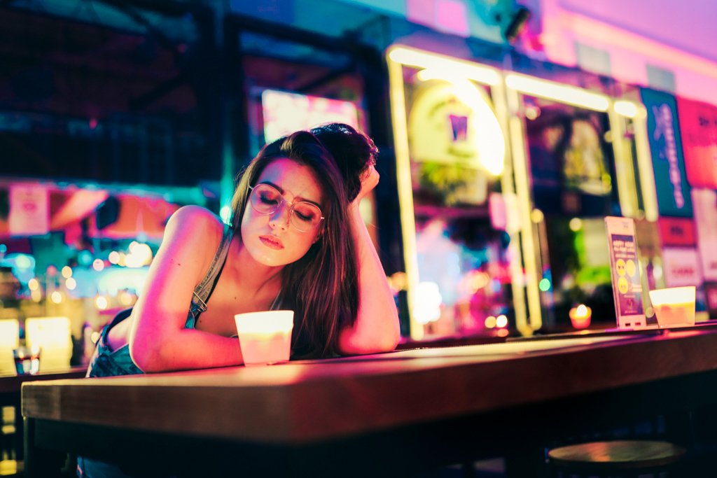 night portrait girl leaning on table