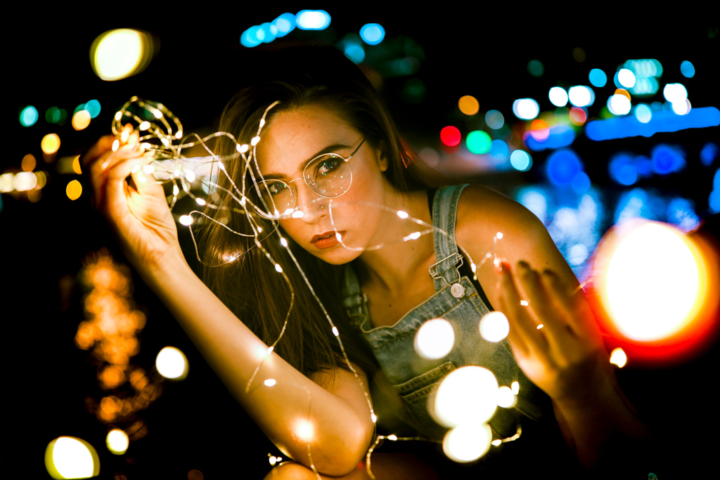 female model with fairy lights and bokeh