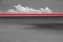 Sea and sky with red line showing horizon