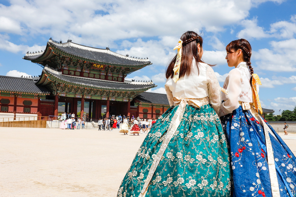 korean girls standing in a courtyard