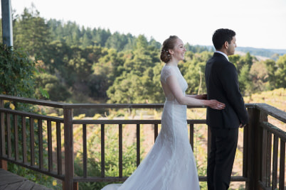 Bride starts to hug groom