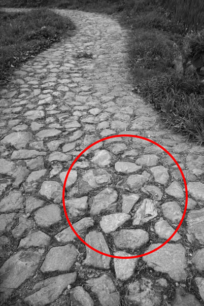 Stone tiles on pavement (marked)