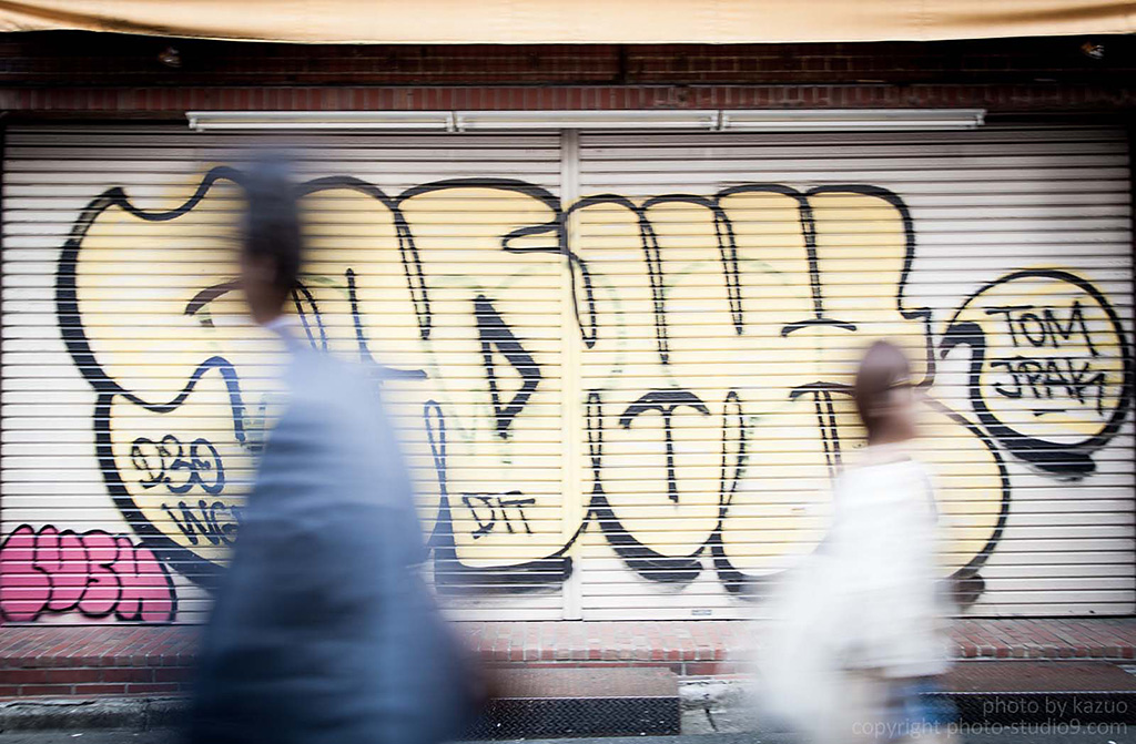 Slow shutter shot against graffiti background