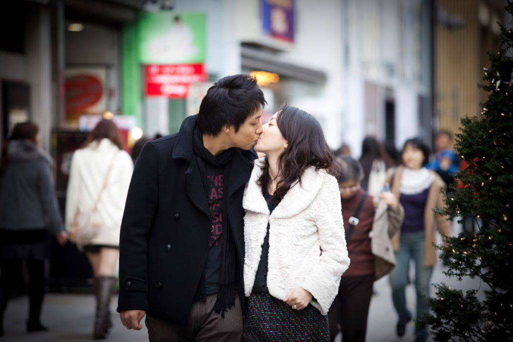 Couple kissing on street