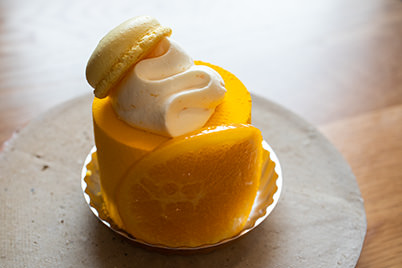 Whole citrus cake showing orange slice