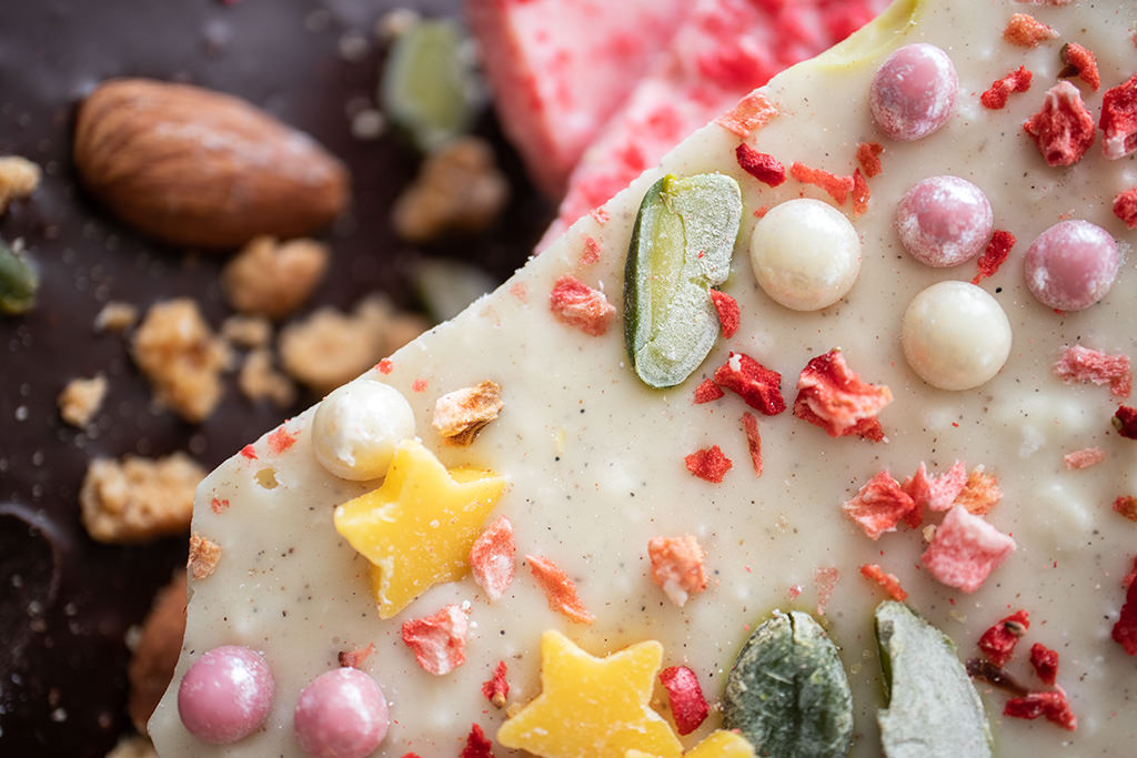 Decorated chocolate bar with decorations in focus