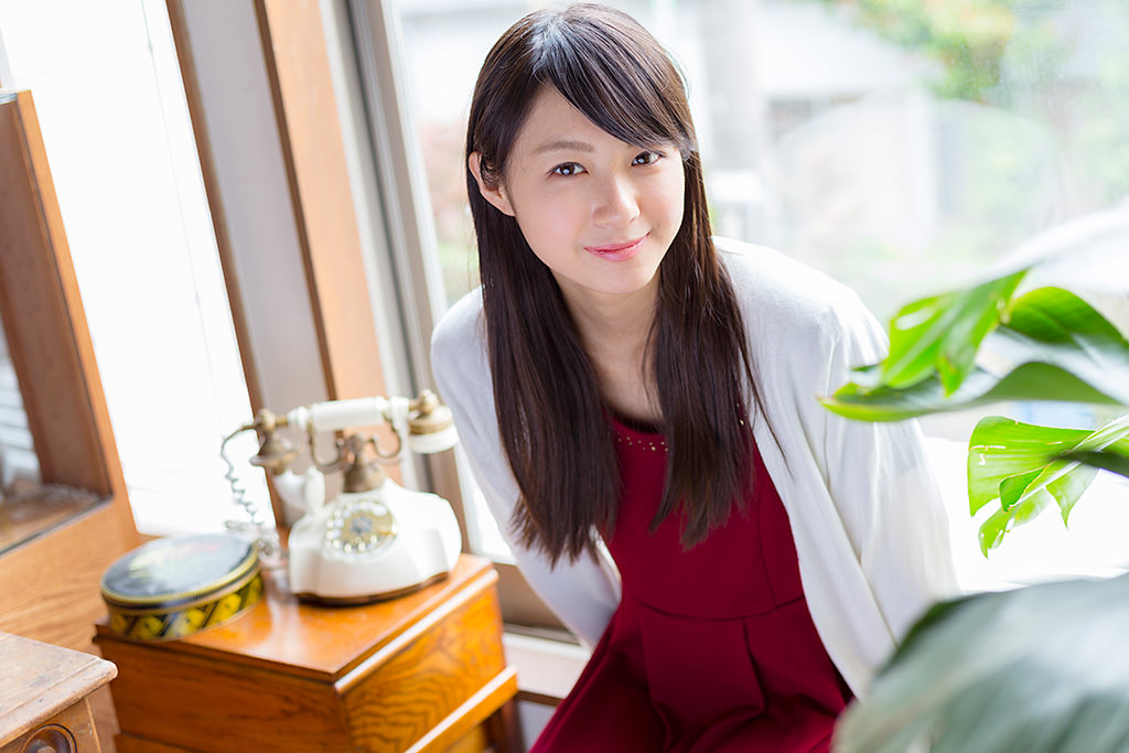 Girl in front of window