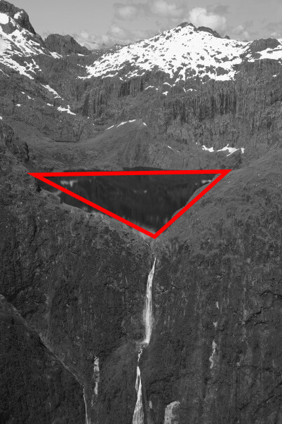 Lake in crater showing triangle