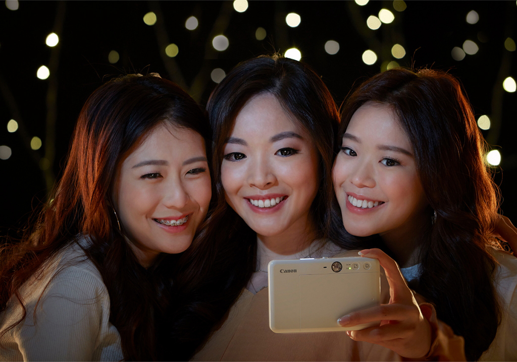 Girls shooting selfie with Canon iNSPiC