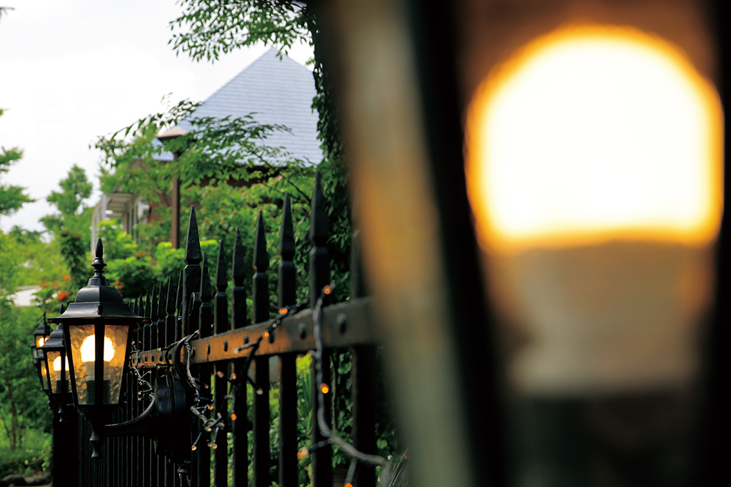 Fence with gas lamps
