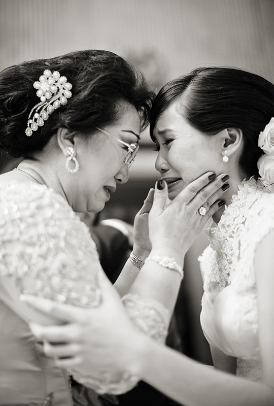 Bride getting emotional with mother