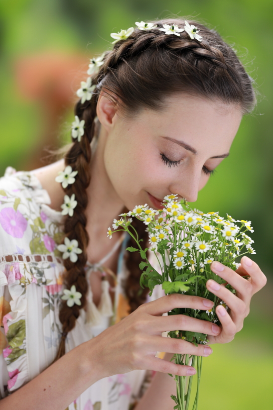 Model with flowers outdoors