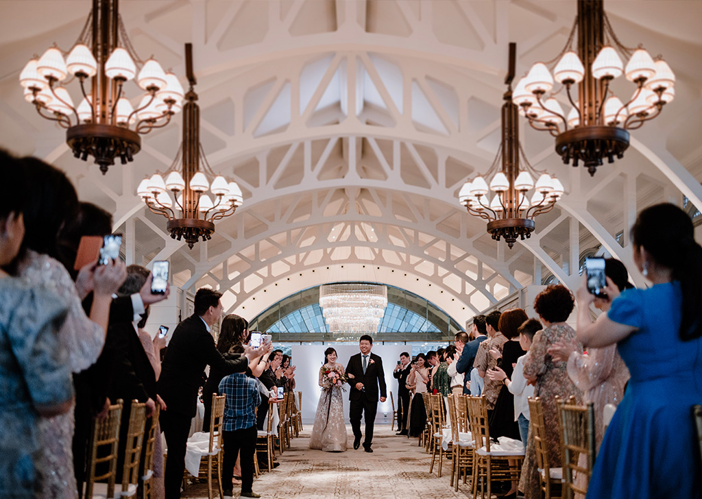 Bride and groom marching in the banquet hall