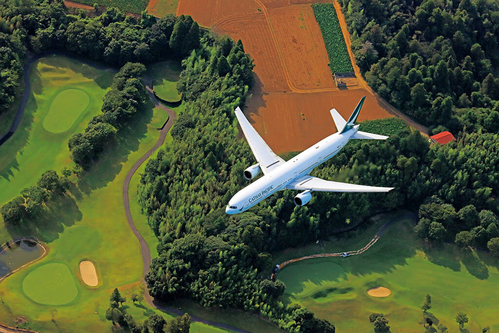 Shot of airplane flying over land