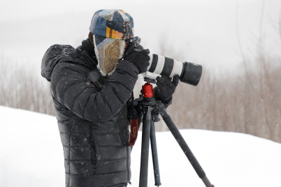 Photographer shooting with camera tilted downwards