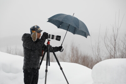 Photographer shooting with umbrella