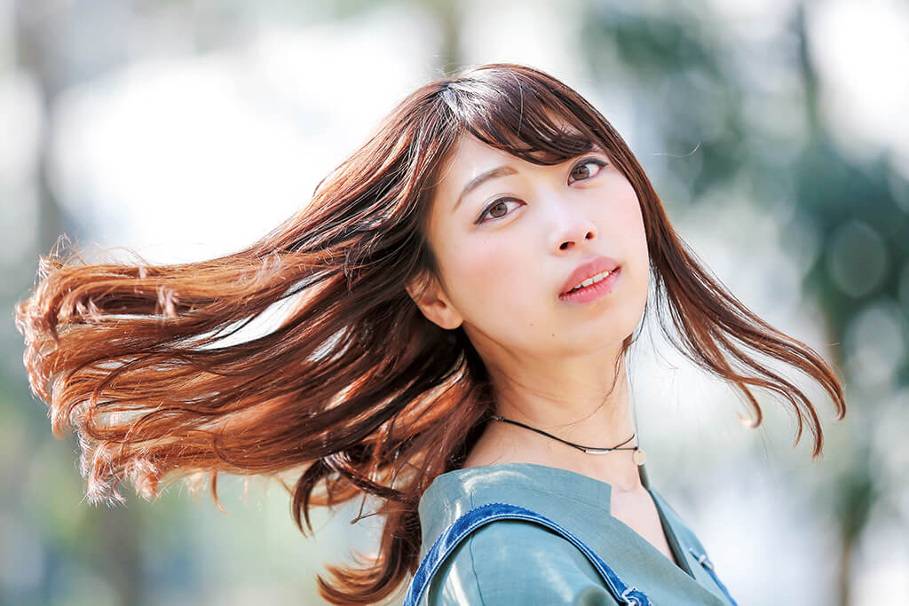 Girl turning her head with flying hair