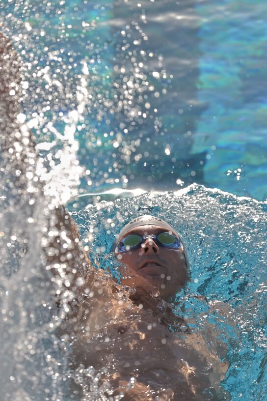 Close up of swimmer doing backstroke (HDR PQ JPEG converted from HEIF)