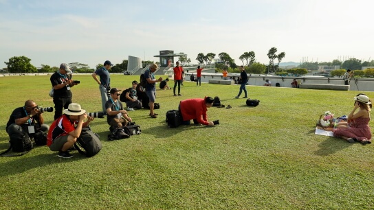 Photographers photographing model at Marina Barrage