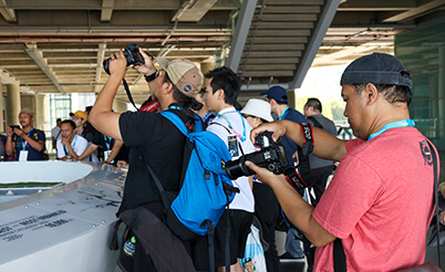 Photographers shooting interactive model of Marina Barrage