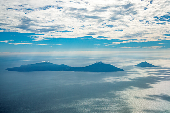 Normal shot of island and clouds