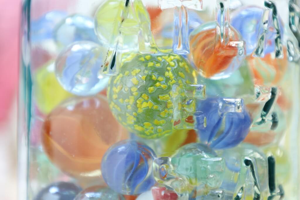 Close-up of marbles in glass jar