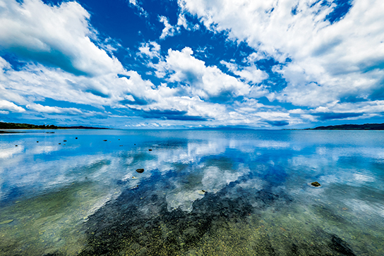 Seascape reflection with blue sky